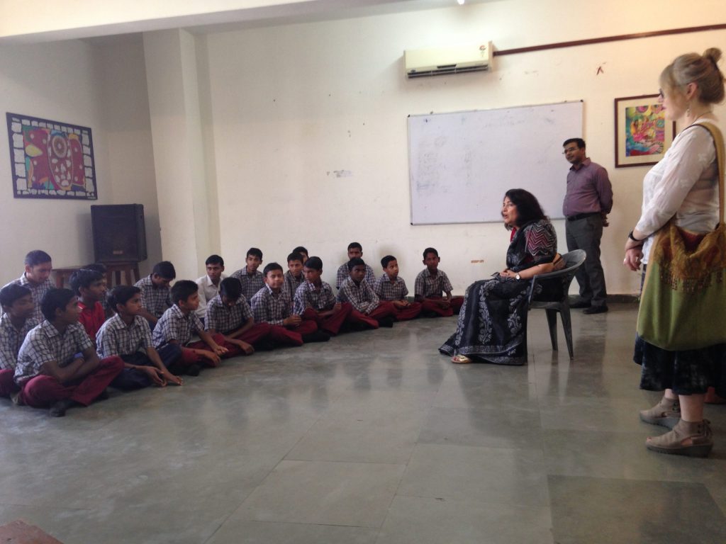 Dr. Urvashi Sahni addressing a group of boys at Prerna