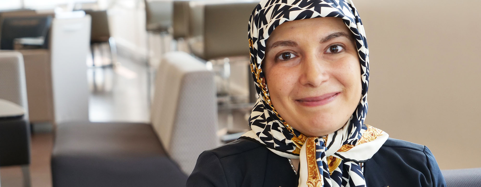 A student smiling and looking directly at the camera. 