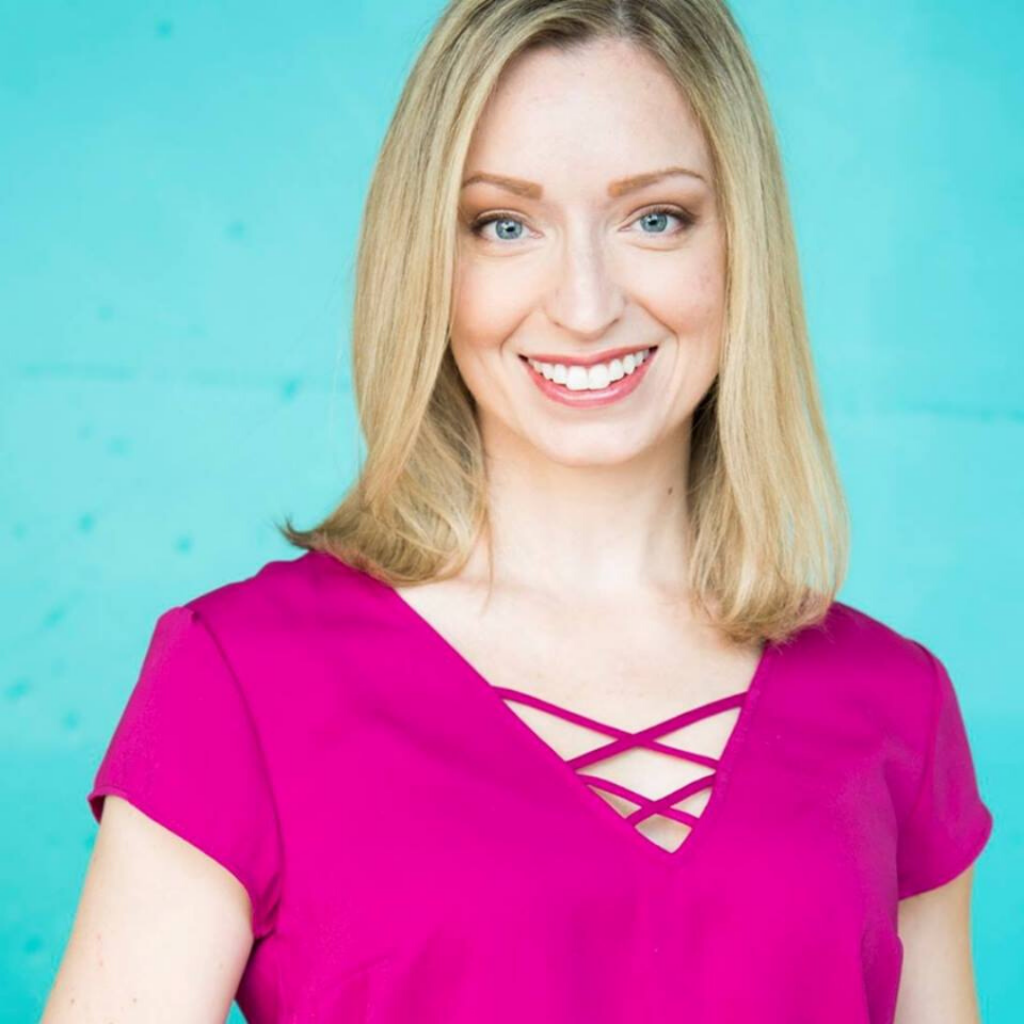 Melissa Bartrem, a blonde woman in a pink shirt smiling against a blue backdrop