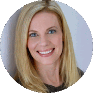 Blonde woman smiling against a white background