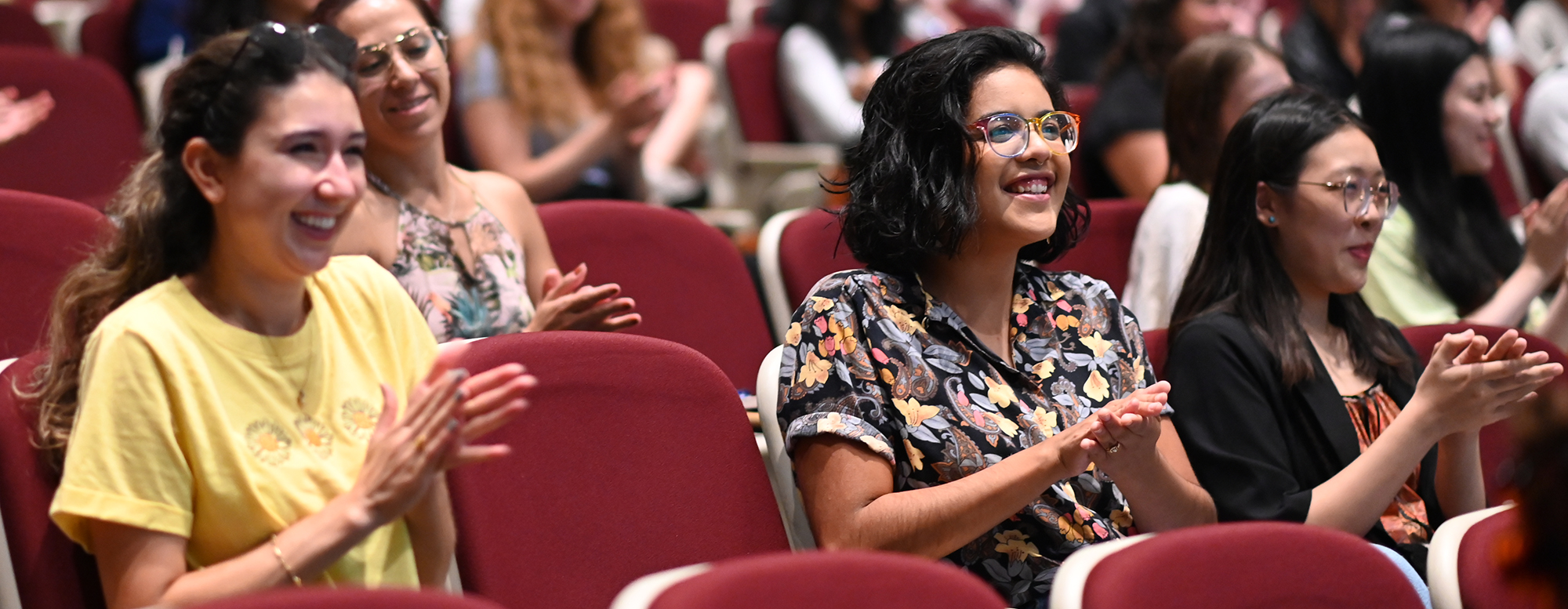 Students attending an event in the OISE auditorium. 