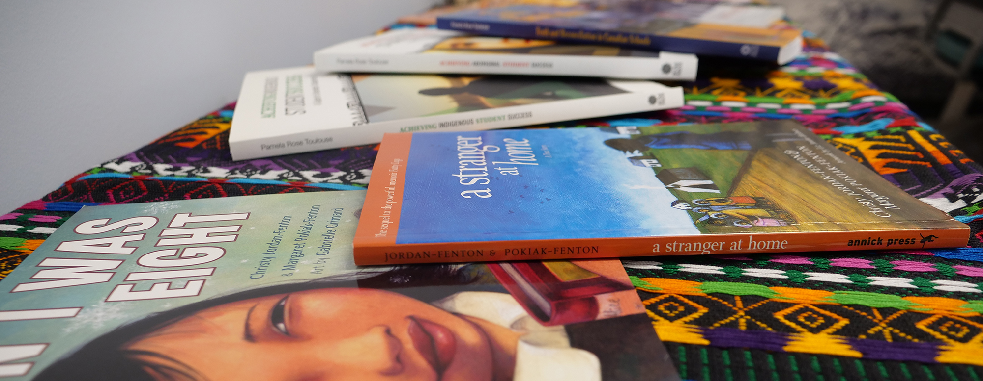 Books lying flat on a table.