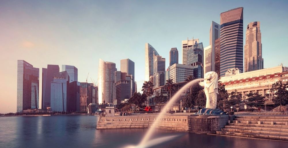 Skyline of Singapore with the iconic Merlion statue in the foreground