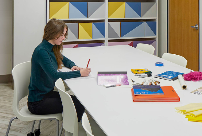 Two students working in a room at OISE.