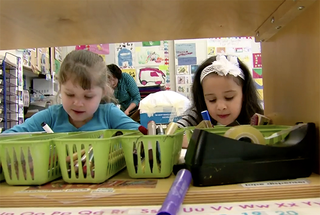 Two preschool students drawing.