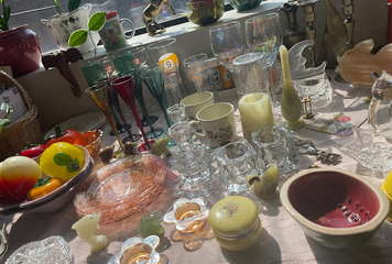 assorted ceramics and glassware on white table cloth