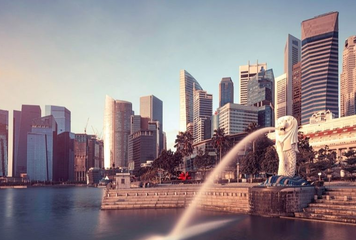 Skyline of Singapore with the iconic Merlion statue in the foreground