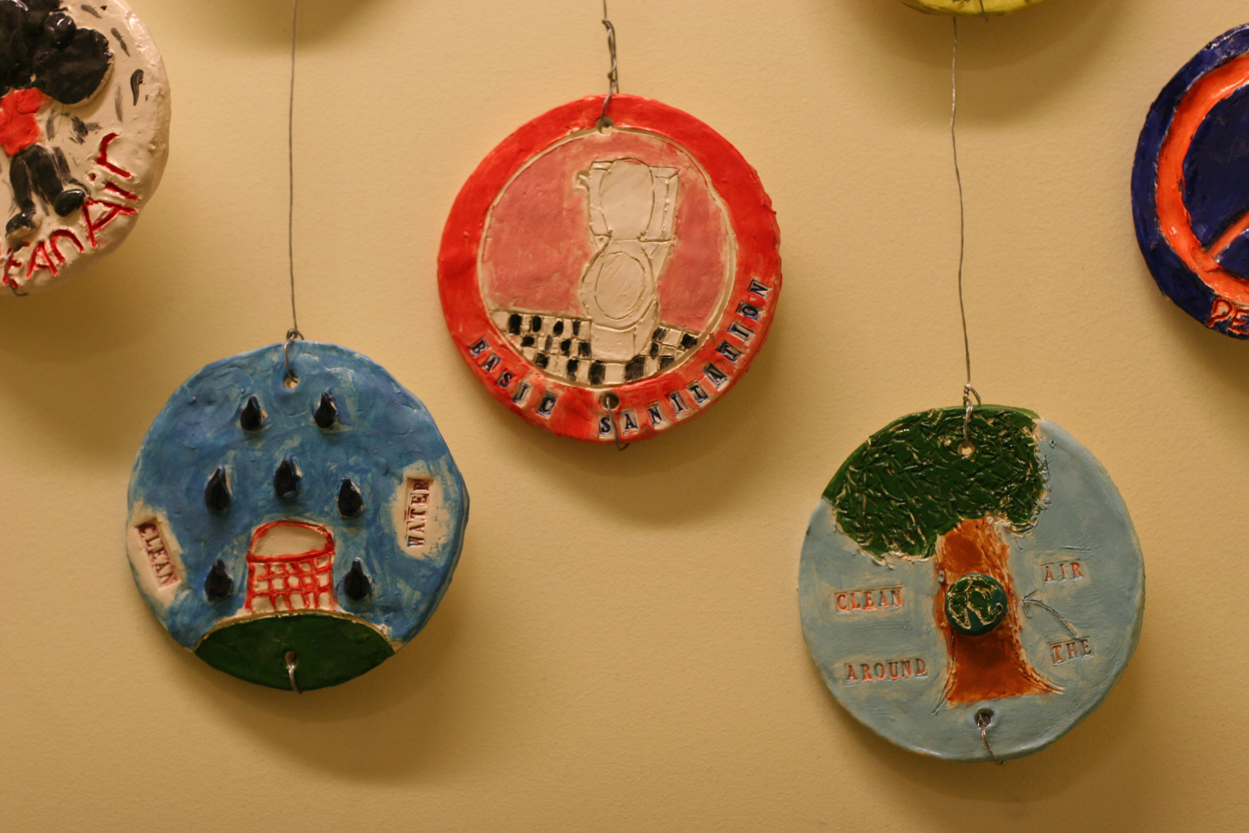 installation detail: round tiles about environmental rights of the child