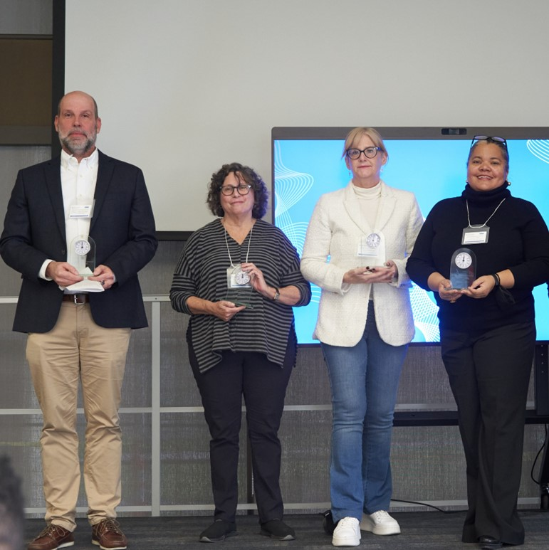 Left to right: Associate Dean, Programs, Joseph Flessa, Professor and Former Chair, Nina Bascia, Associate Vice-President, Barbara Fallon, OISE Dean, Erica Walker accepts a token of appreciation.