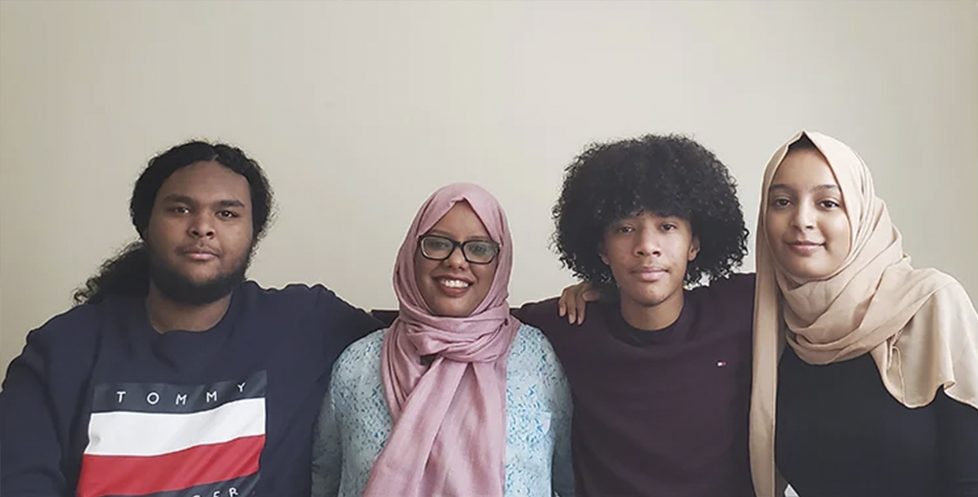 Mariam, second from left, poses with her three children