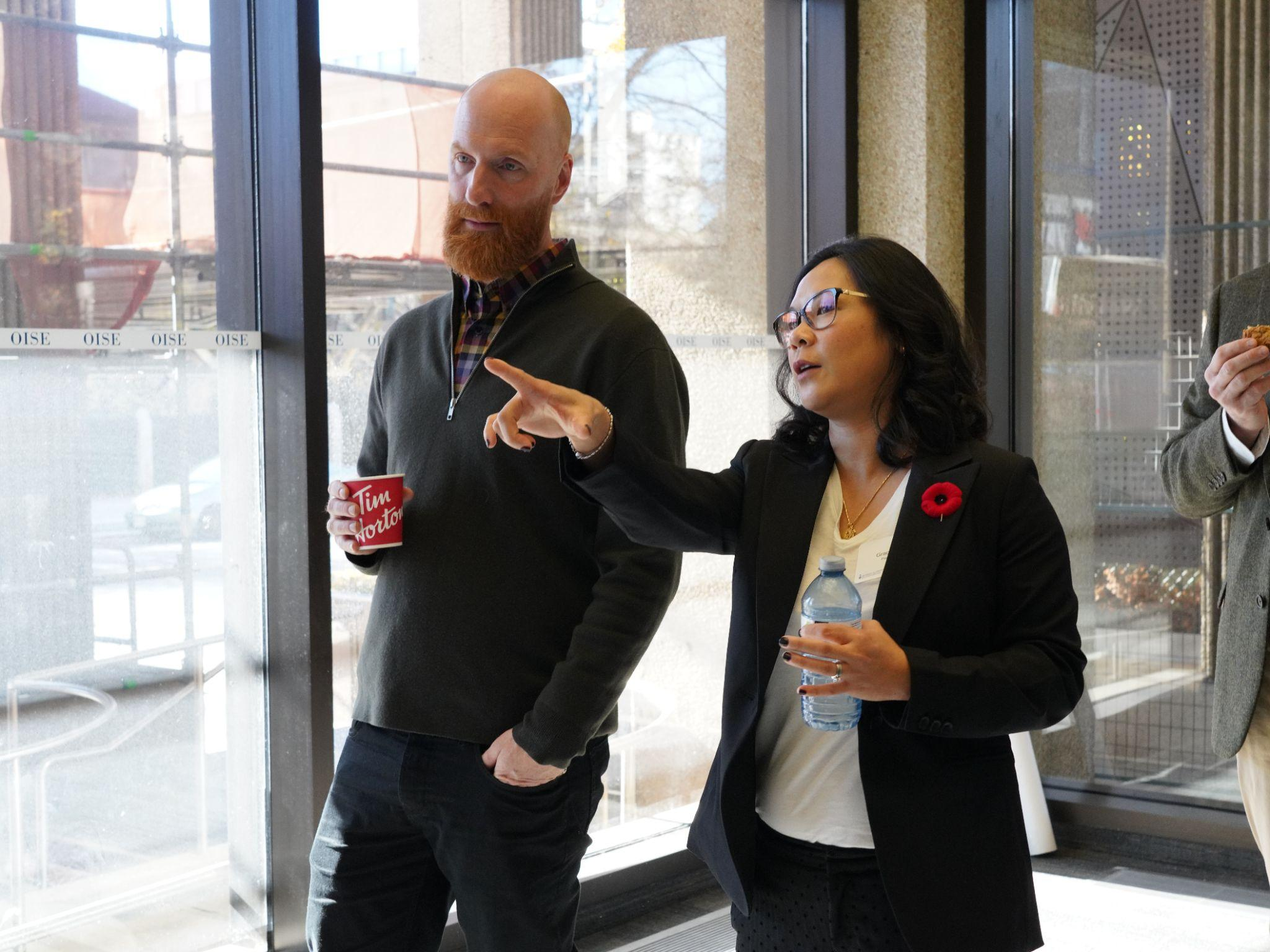 NBEPS student presenter Grace Kim showcasing her work to an attendee.