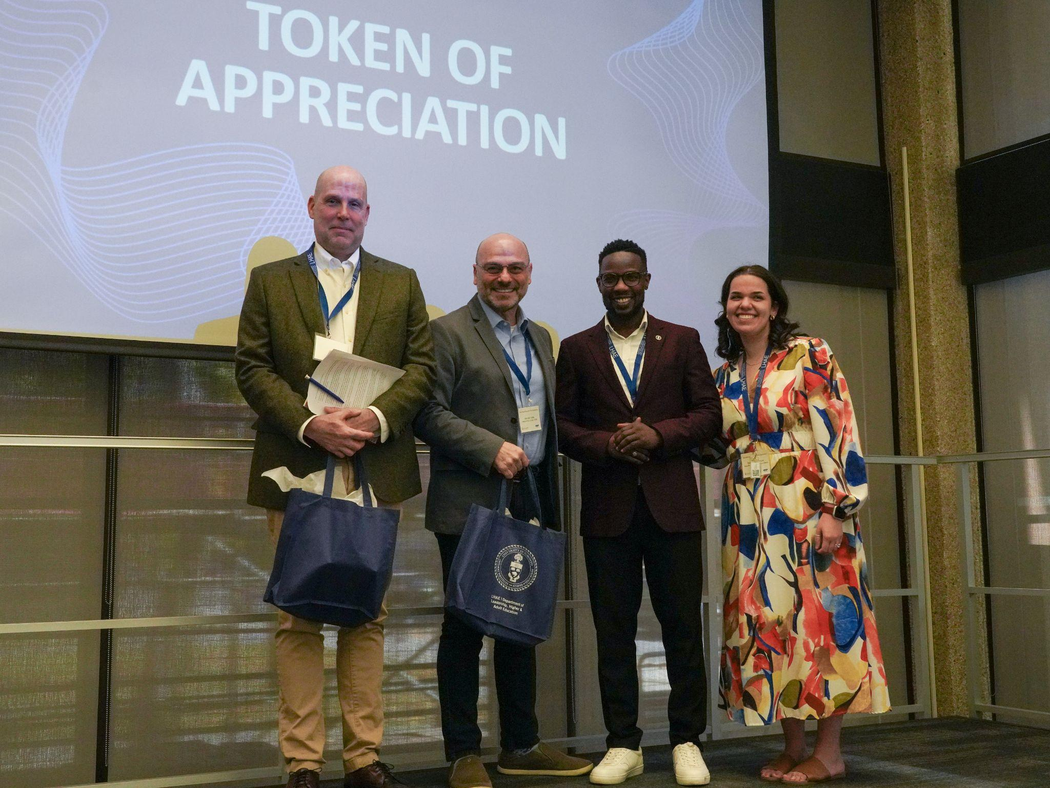 Left to Right: Associate Dean, Programs, Joseph Flessa and Interim LHAE Chair, Marcelo Vieta, accept a token of appreciation.