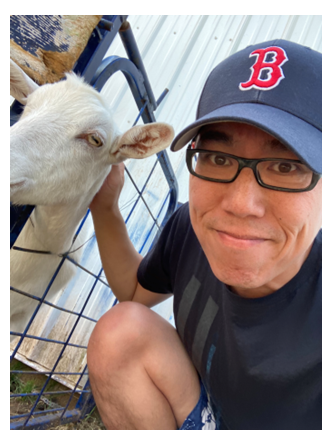 Image of Steve Tu with a goat