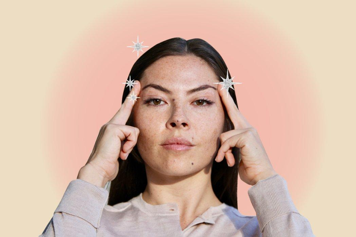 A woman doing face yoga.