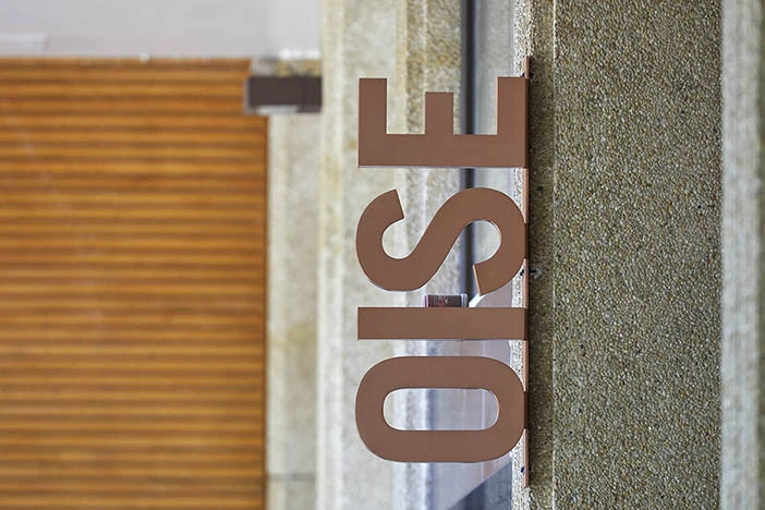 An OISE exterior building sign