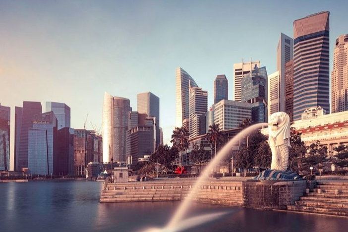 Skyline of Singapore with the iconic Merlion statue in the foreground