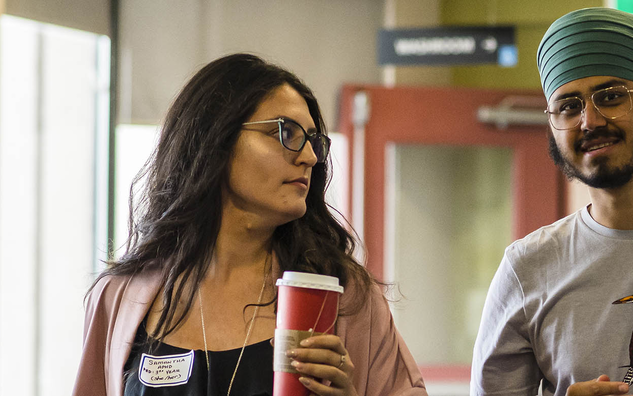 Two students walking and chatting at OISE Orientation.