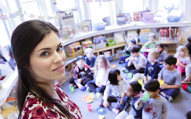 A teacher and classroom of students at JICS.