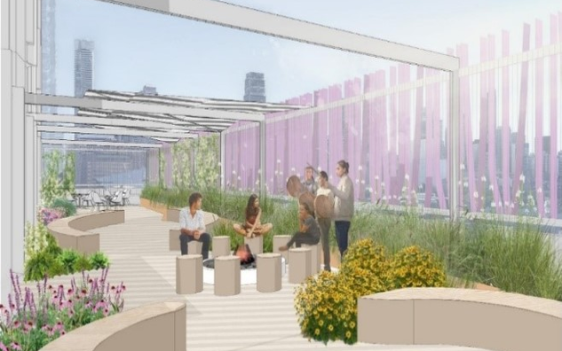 This is an image of the IEN Social & Cultural Practice Space (South Terrace) looking East. There are individuals sitting in an open-air space with colourful flowers