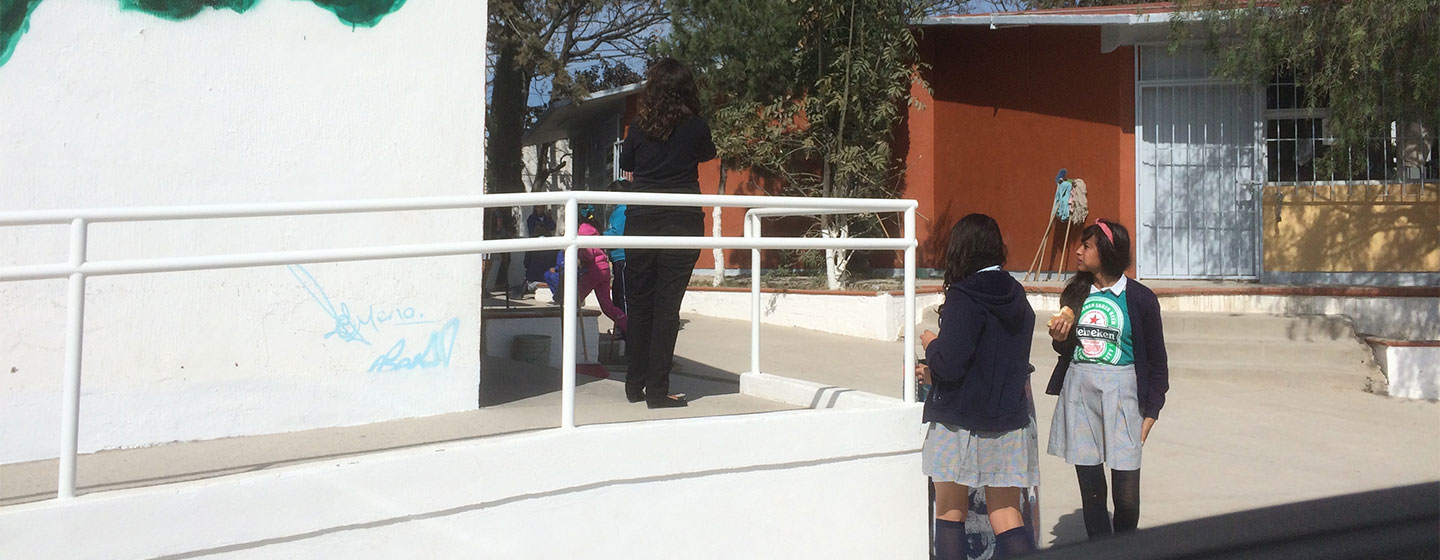 students in school yard eating lunch