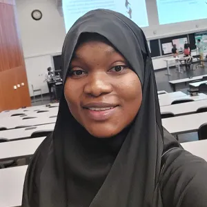 Headshot of Aisha Adebayo.