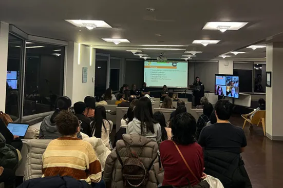 People watching a presentation at the Publishing Party.