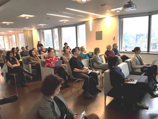 An audience watching a presentation.