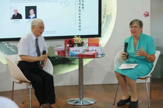 Ruth Hayhoe seated and speaking at an event.