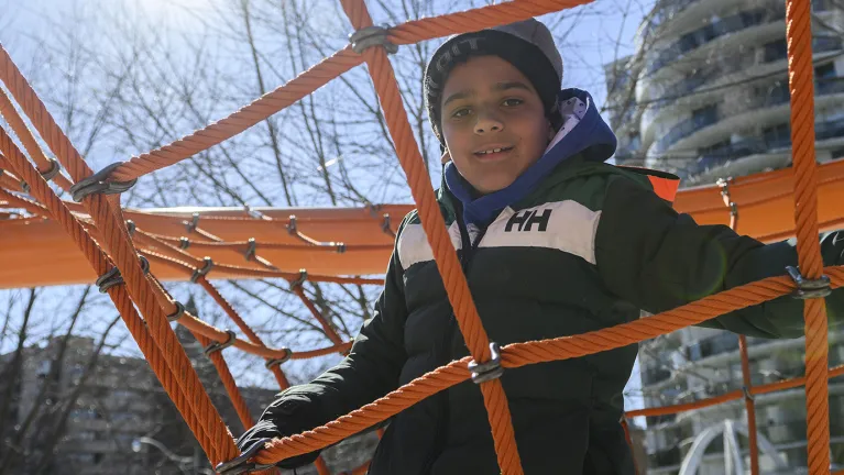 A student playing in the Dr. Eric Jackman Institute of Child Study playground. 